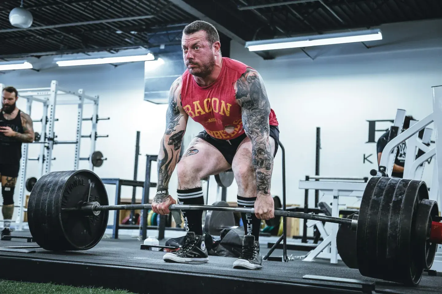 A lifter at the bottom of a heavily loaded squat